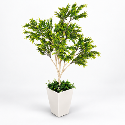 Artificial green foliage tree in white planter - side