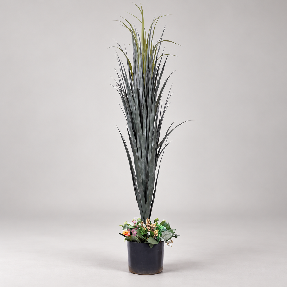 Artificial tall grass plant with wildflower base - side-view